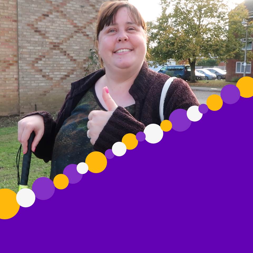 Image of young disabled lady with her thump up